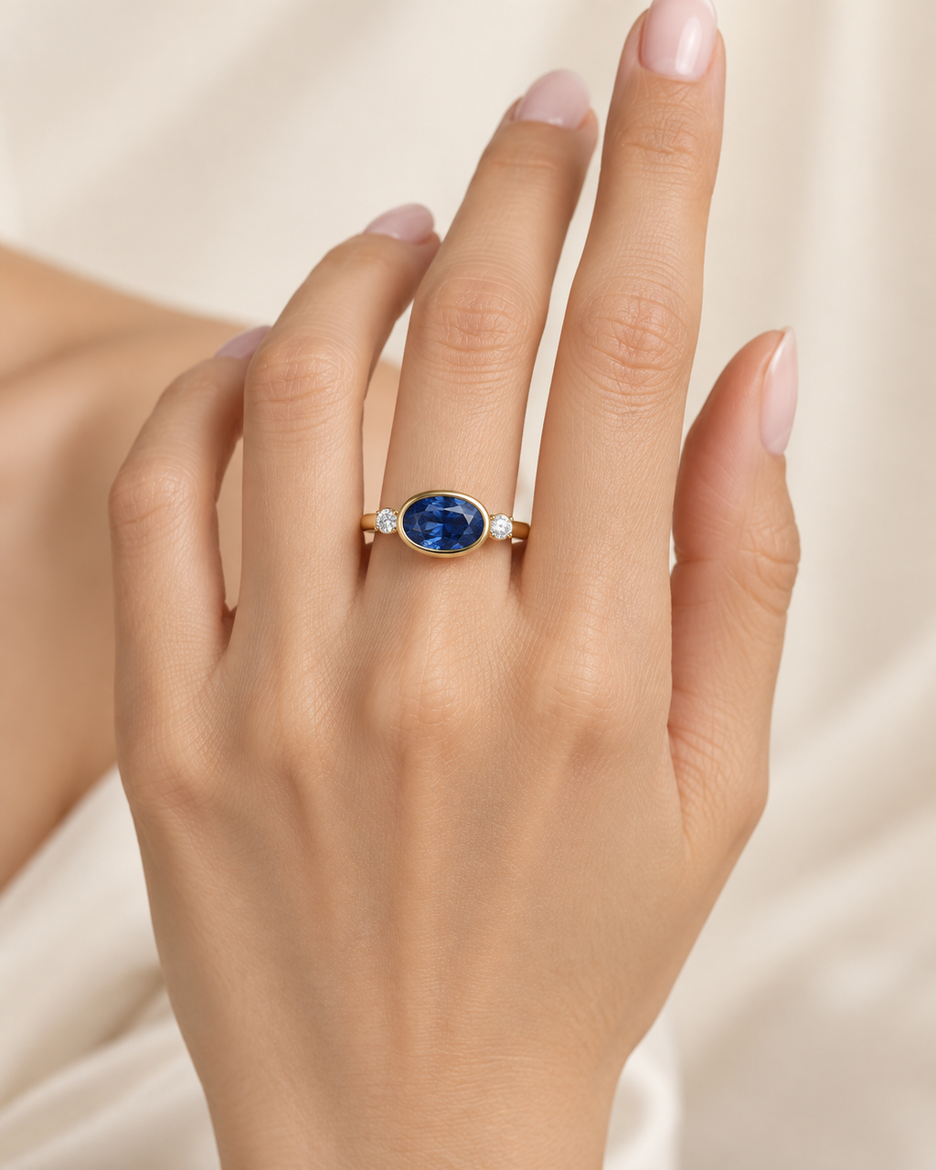 Oval Blue Sapphire Three-Stone Ring