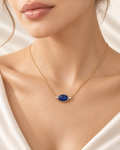 Oval blue sapphire and diamond necklace on model