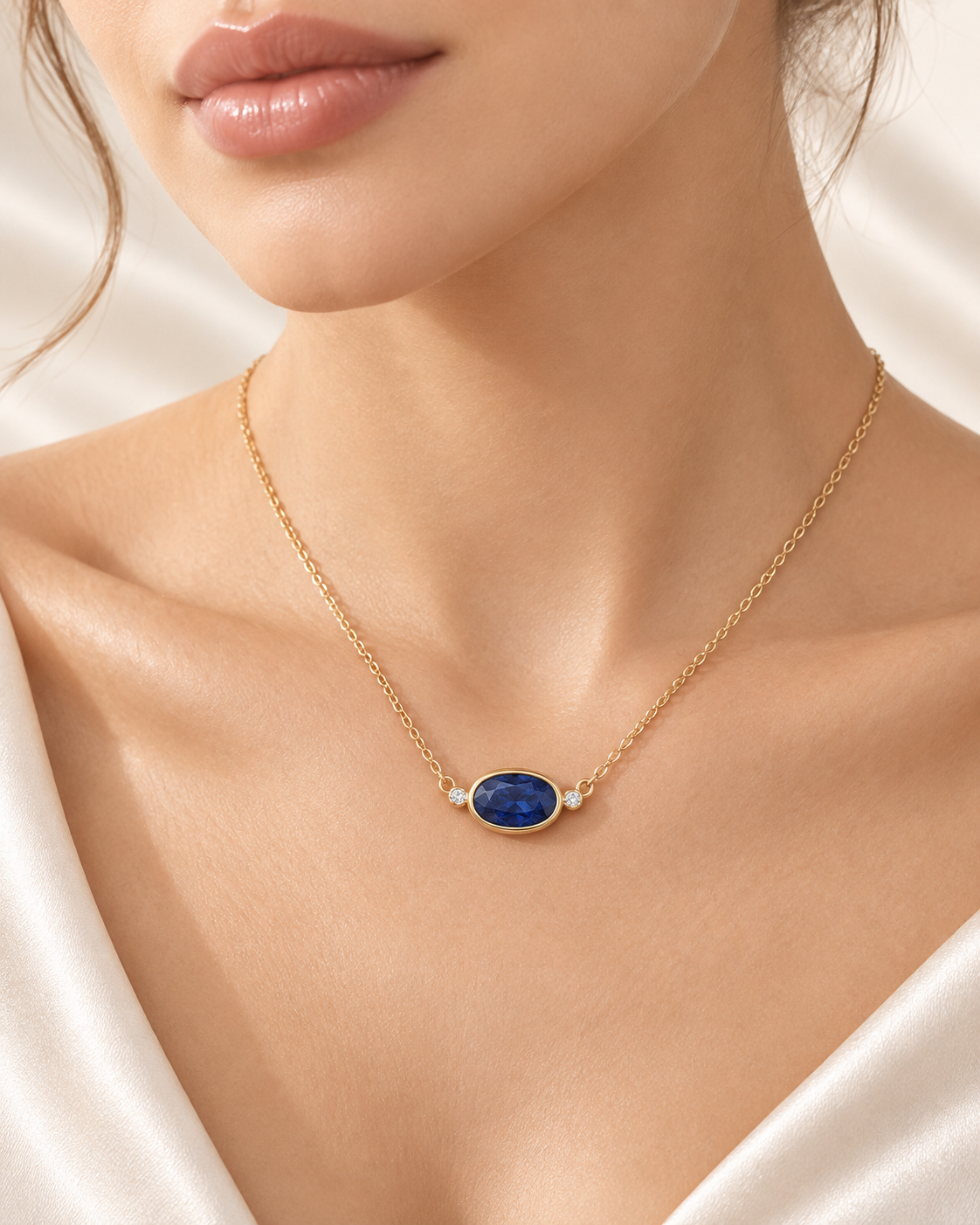 Oval blue sapphire and diamond necklace on model